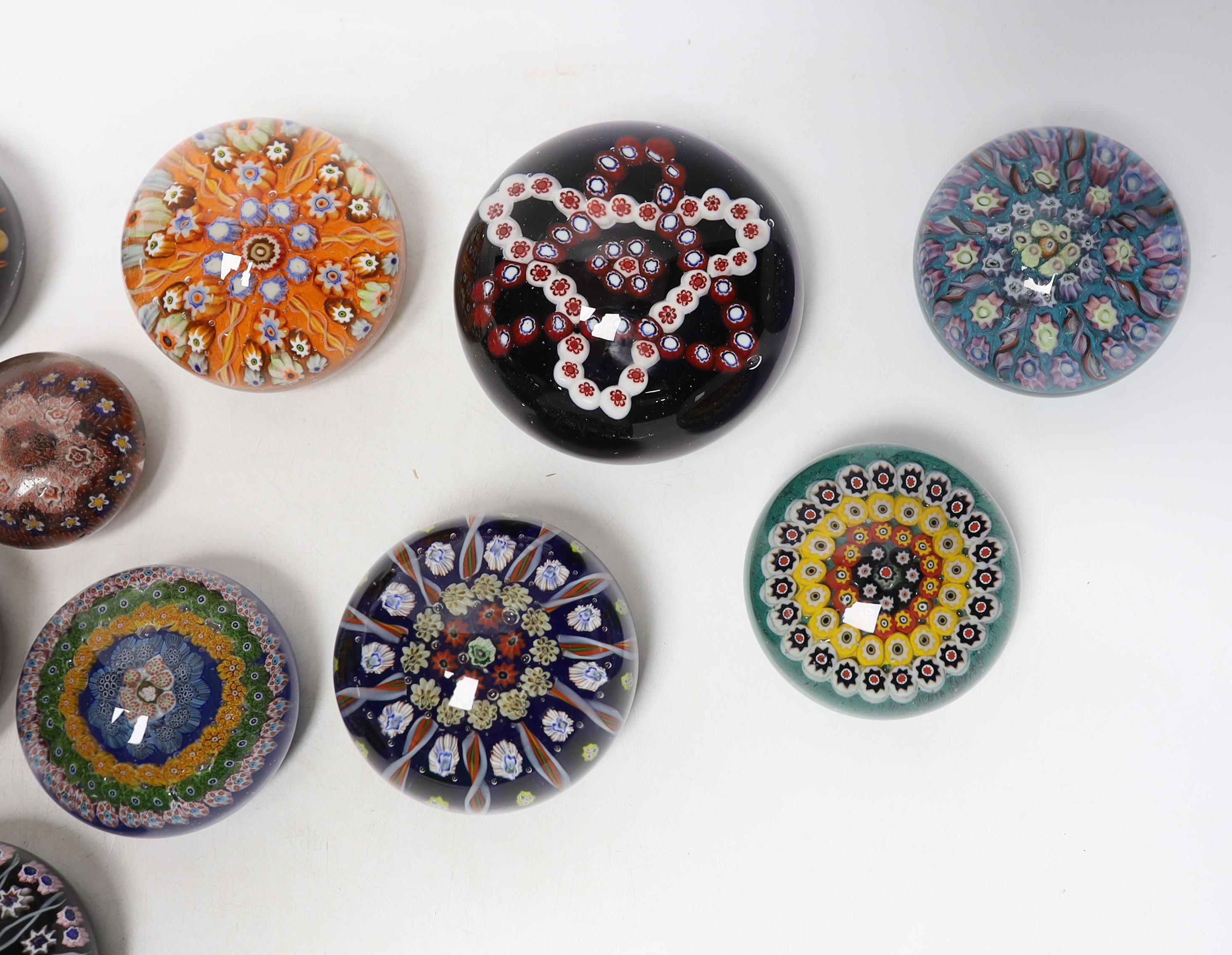 Twelve various mixed glass paperweights